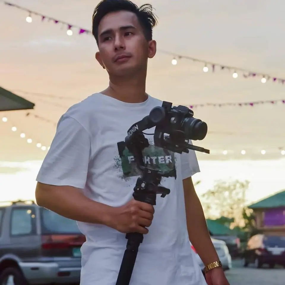 Jeremiah Palma holding a camera